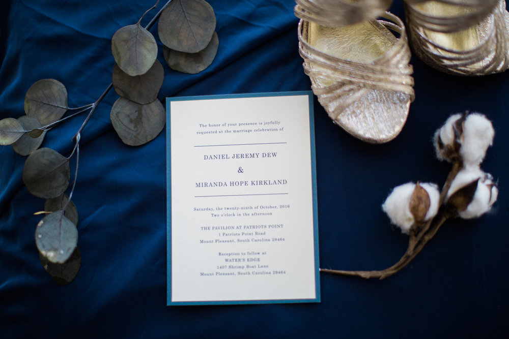 Photo of Wedding Invitation and brides shoes