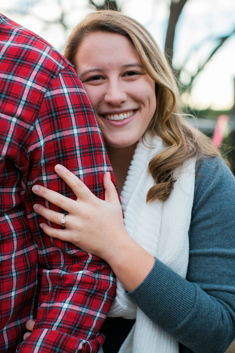 Megan Smiling and showing her engagement ring