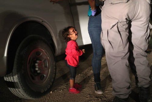  A two-year-old Honduran asylum seeker cries as her mother is searched and detained near the U.S.-Mexico border on June 12, 2018 in McAllen, Texas.&nbsp;(Photo: John Moore, Getty Images) 