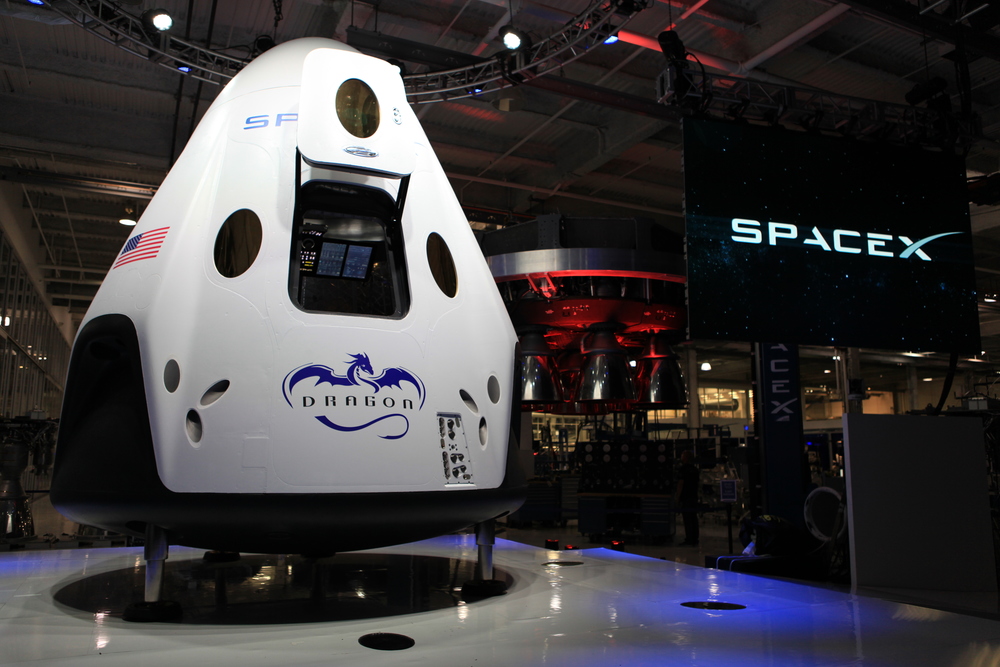 SpaceX unveiled its Dragon V2 spacecraft designed to carry humans into orbit. The company's founder and CEO, Elon Musk, detailed aspects of the design that was developed in partnership with NASA's Commercial Crew Program. Image Credit: NASA/Dmitri Gerondidakis
