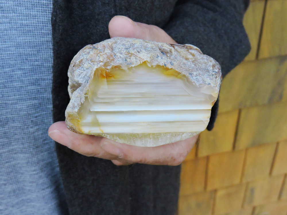 An orange banded agate from Dutes' private collection. Dutes has collected agates and other local minerals since he moved to Haida Gwaii in 1970.&nbsp;