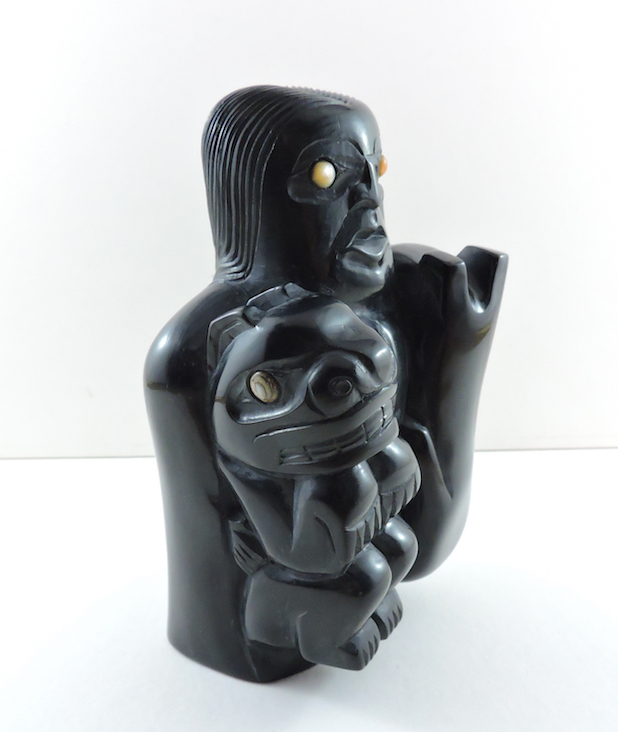 This argillite piece represents the Haida Bear Mother Story and is carved by Haida Artist, Michael J. Brown. This piece can be purchased on our website.