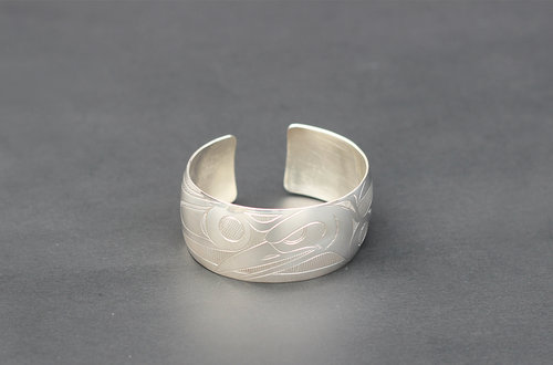 Haida Raven Silver Bracelet:  http://www.crystalcabingallery.com/shop/haida-jewellery/haida-raven-silver-bracelet