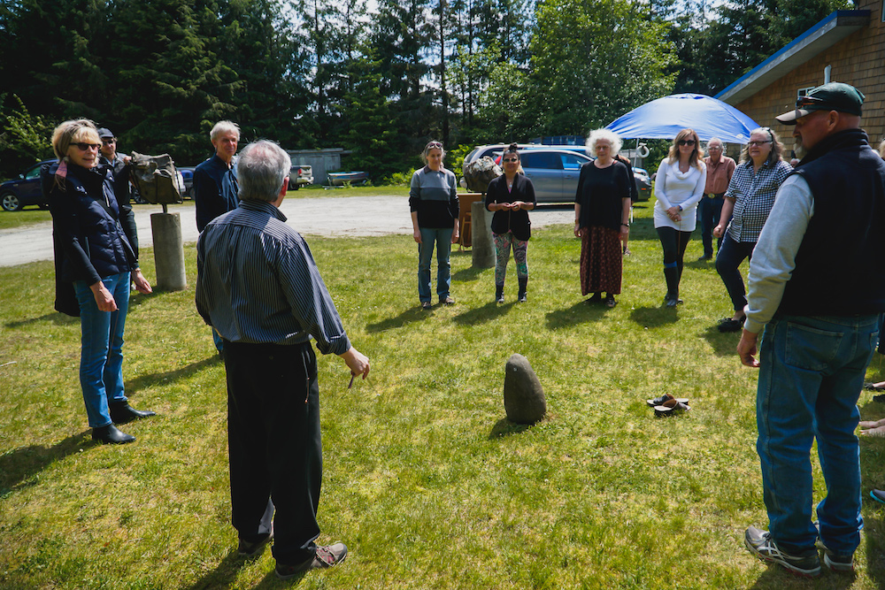 Neil Blacklock instructs guests in an exercise in dowsing - using copper rods one can detect the energy ley lines intersecting the Tlell Stone Circle! Photo by Patrick Shannon /&nbsp;www.innonative.ca