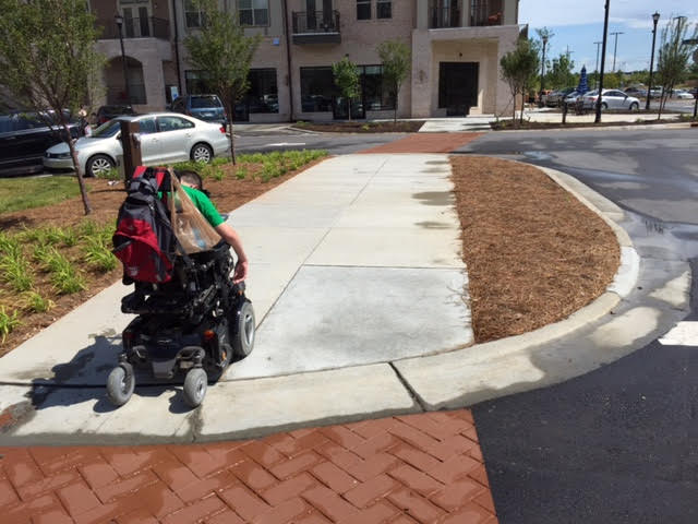                                                                                 Christopher enjoying the wide new sidewalks in the new part of the city he is moving to.