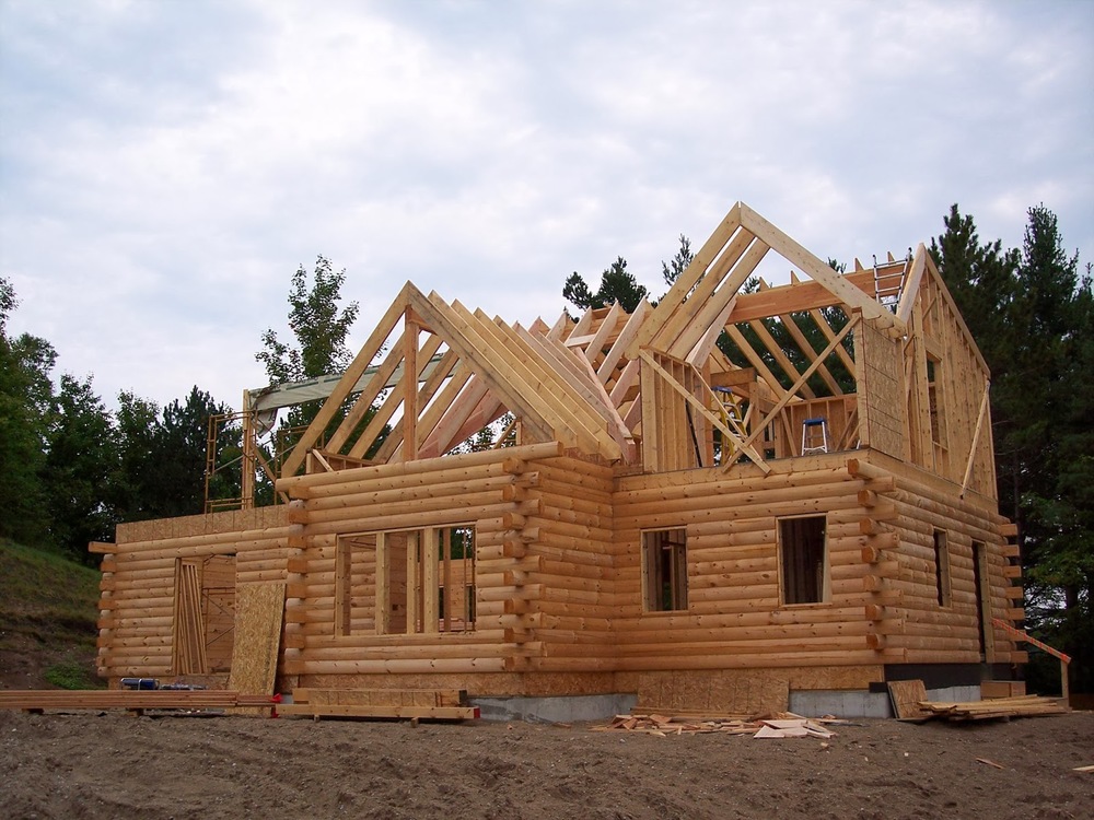 How can you build a log home without spending too much?