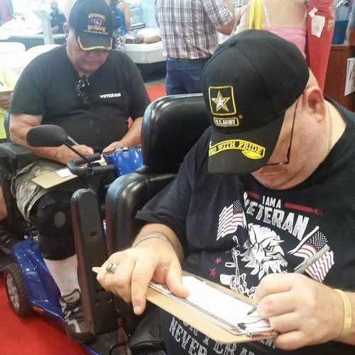 Iowa veterans with disabilities registering to vote. Photo from official Iowa Secretary of State Facebook page.