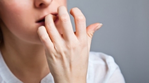 What nail biting really means, according to psychology