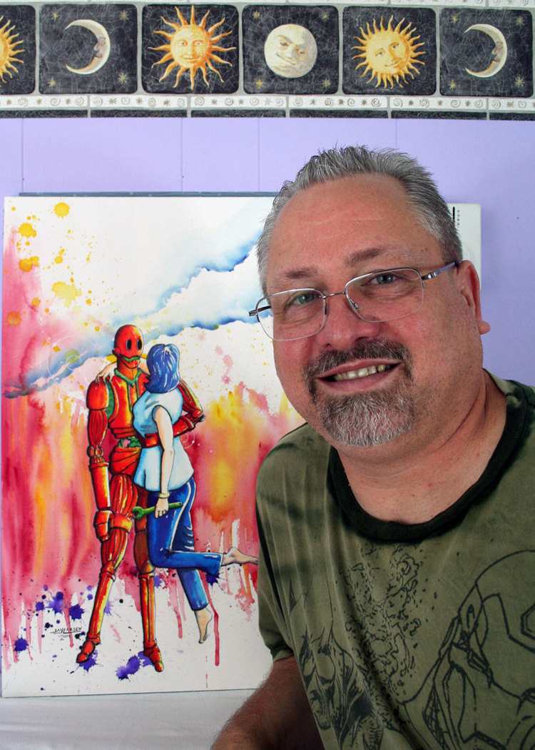 Artist Jay Larsen with one of his Retro Robot Watercolor Paintings.