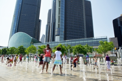 Kids play at the Detroit Riverfront fountains. 