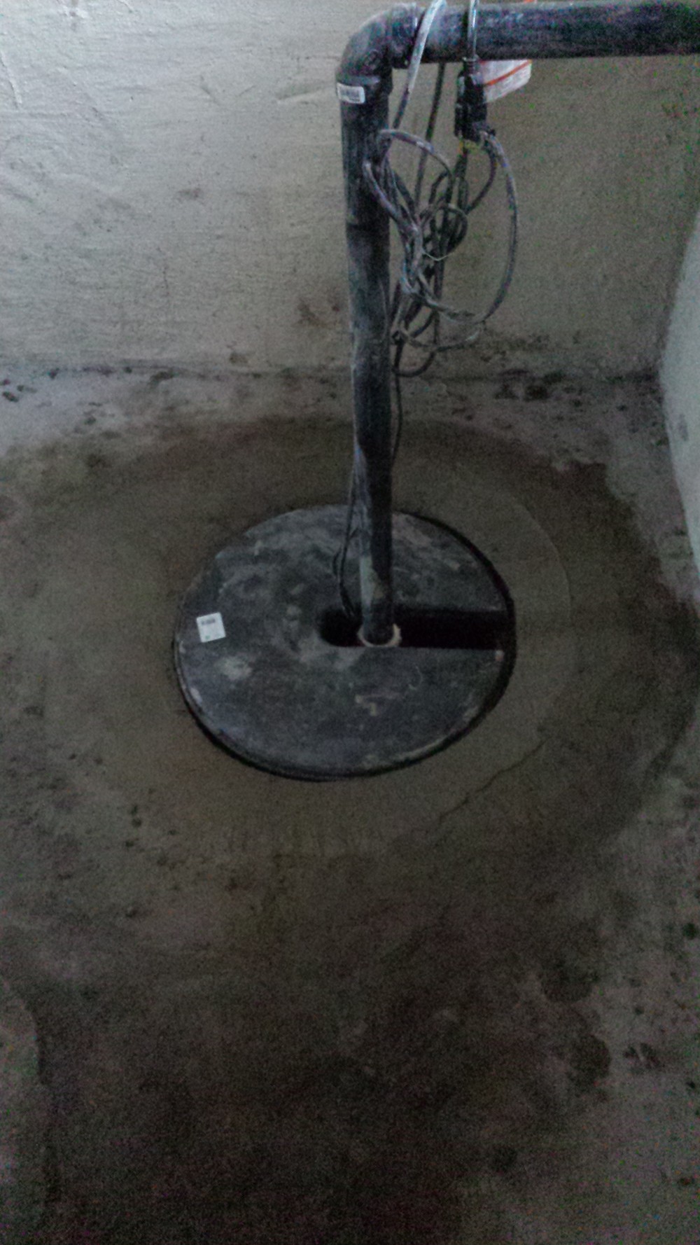 How do you use a pump to remove water from a basement?