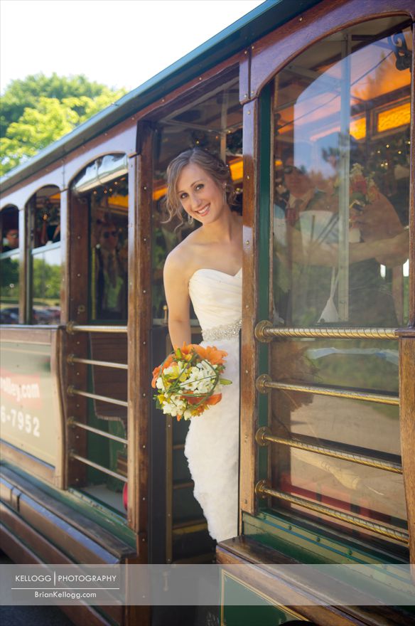 Bride hanging off of Trolly