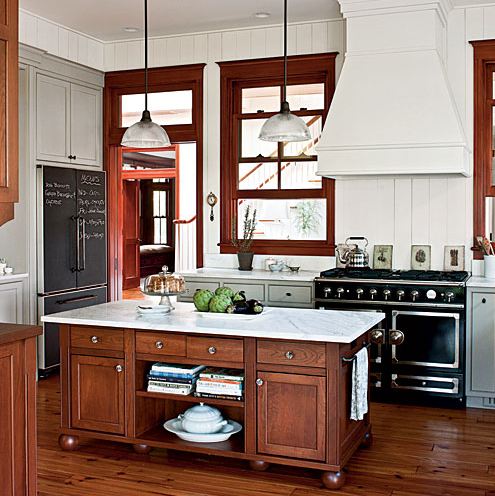 dark wood trim in kitchen with white walls and gray cabinets
