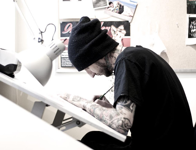 One of the artists sketching at Imperial Tattoo in Toronto
