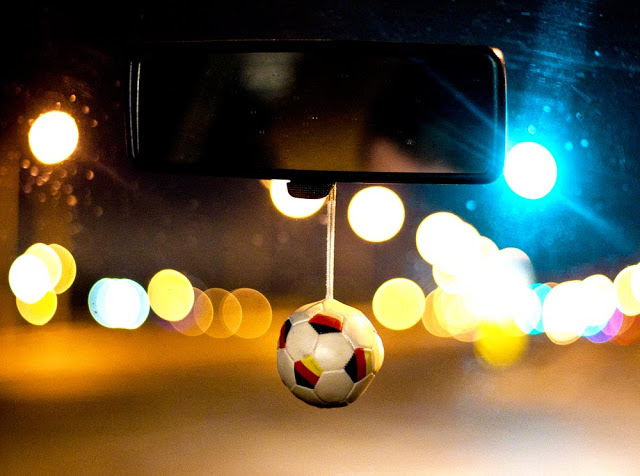Soccer ball dangling from a mirror