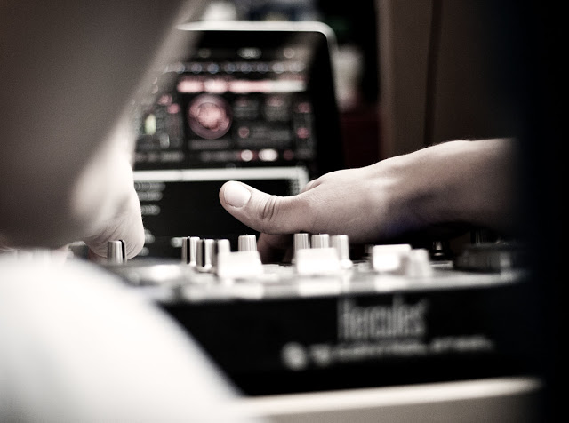 A DJ mixing on a Hercules mixer.