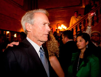 Clint Eastwood rushing past cameras