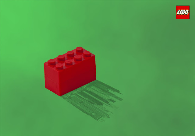 A Lego Advertisement of a block casting a cityscape shadow