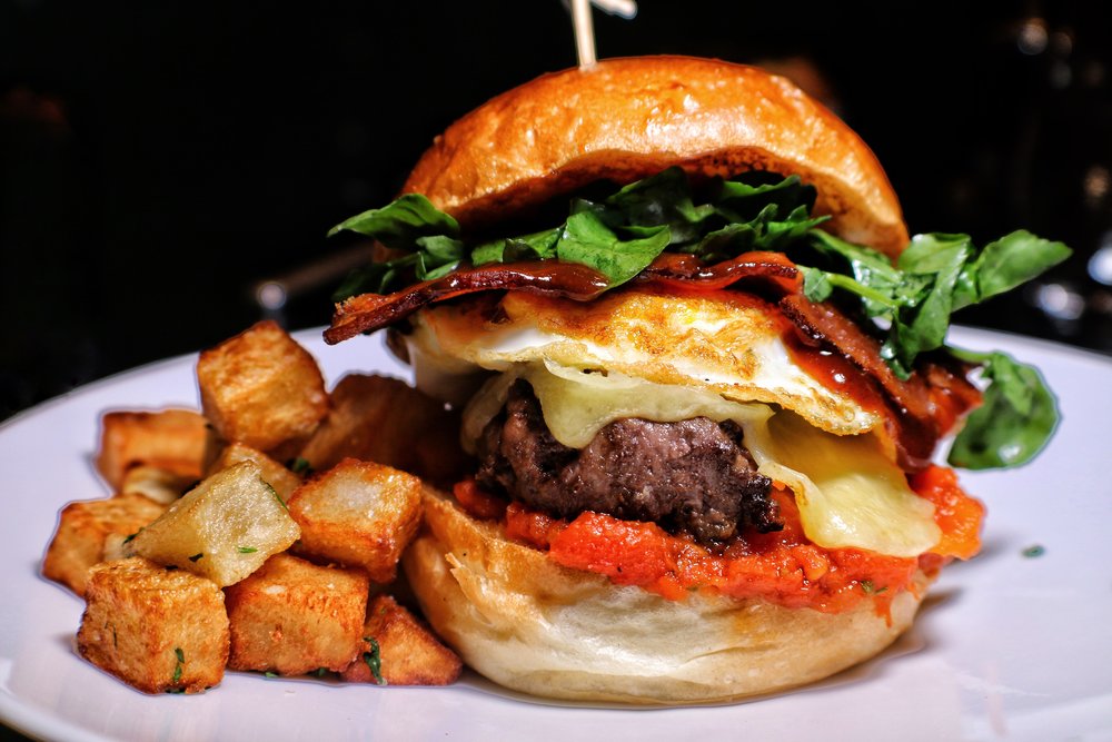  Brunch Burger, aged burger, brioche roll, fried egg, tomato jam, bacon 