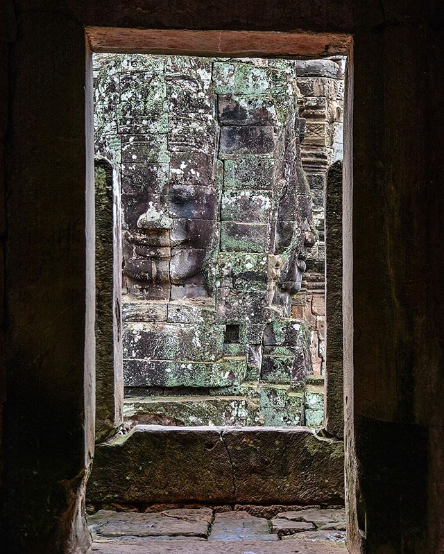 Frame within a frame. Finding a quiet moment at the iconic Bayon temple in Angkor.