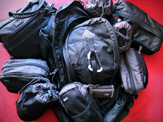 The Kelty Redwing backpack with Think Tank change up bag and various Think Tank pouches to keep gear protected during travel.