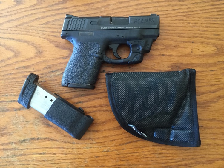 Concealed under the shirt: M&P Shield with LaserMax, mag in Kytex holder and the holster