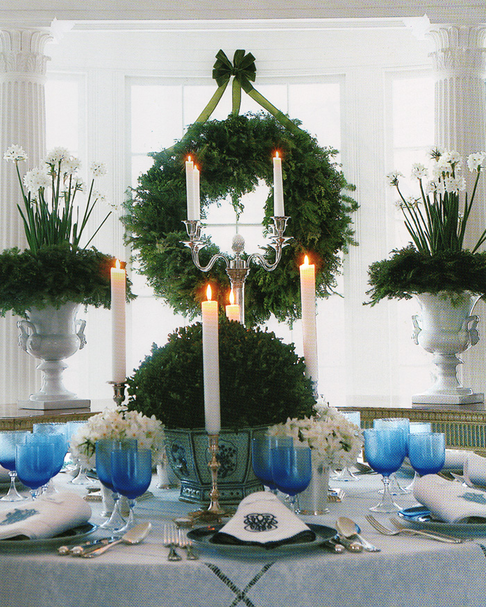 Carolyn Roehm uses blue and white, boxwood, Paperwhites, and monogrammed linens to create a spectacular Christmas table