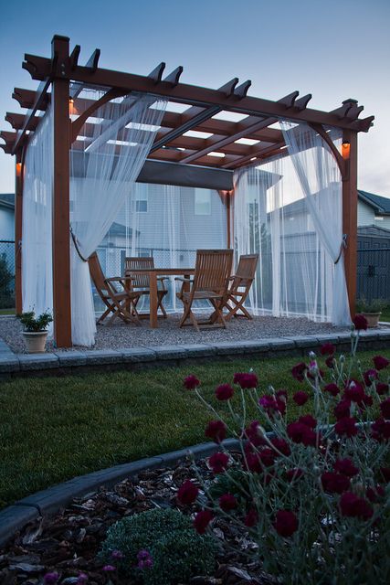 classic pergola with side curtains