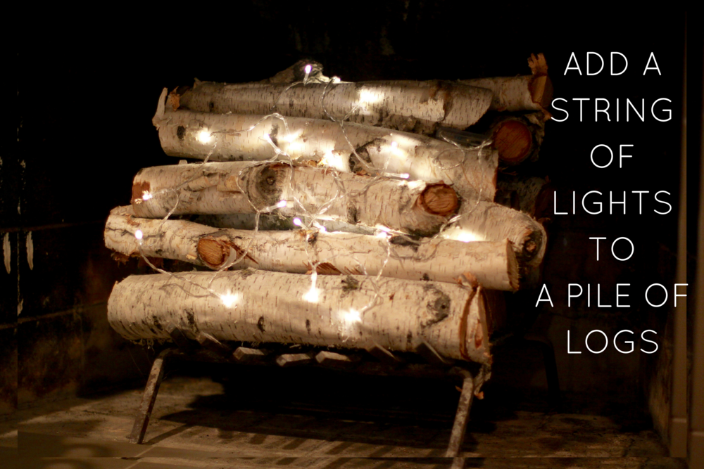 Easy Fireplace Idea—Battery-Operated Strand Lights Wrapped around Logs