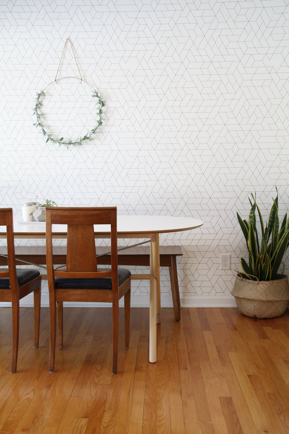 Mid century dining room with wallpaper