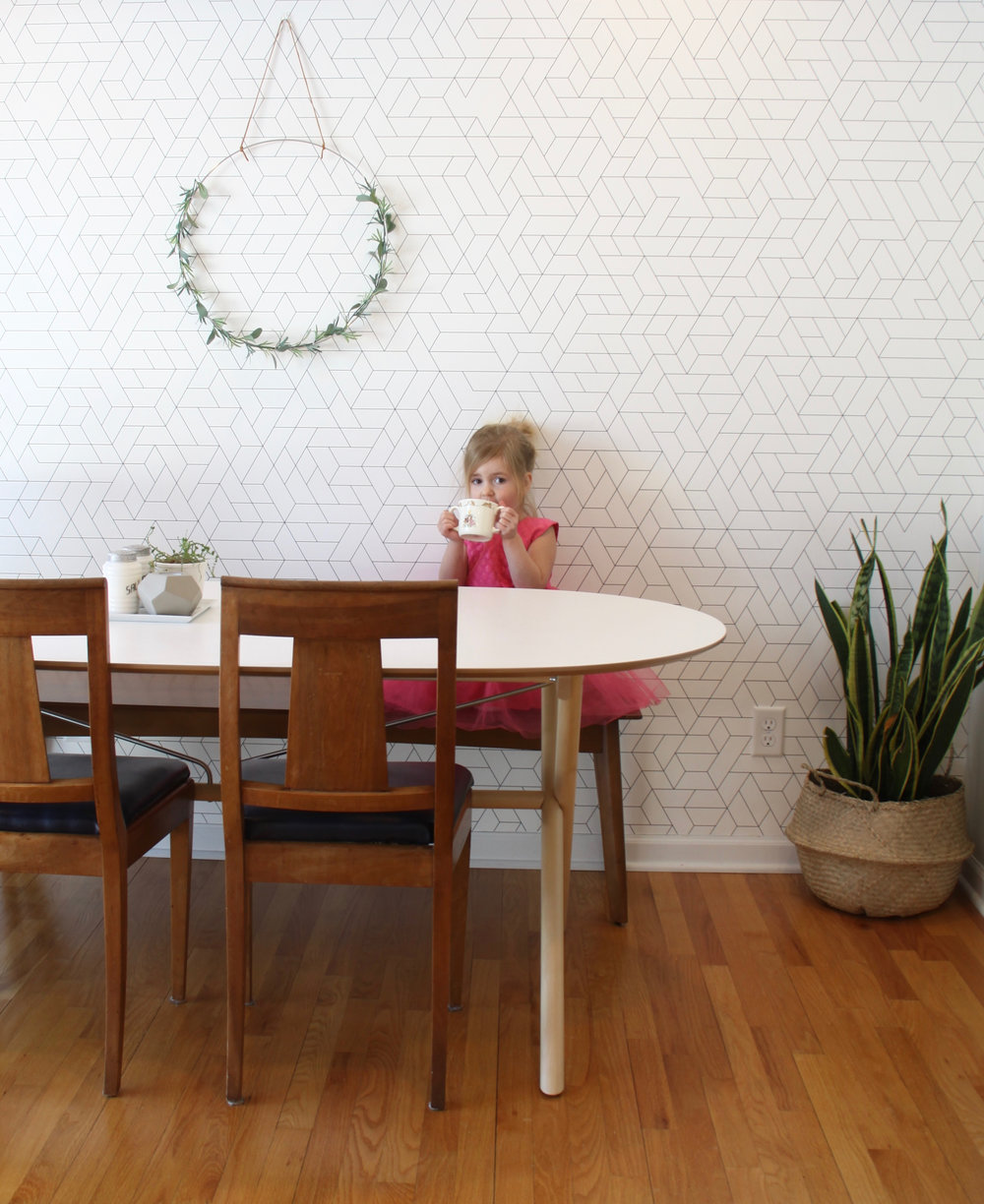 Mid century dining room with wallpaper