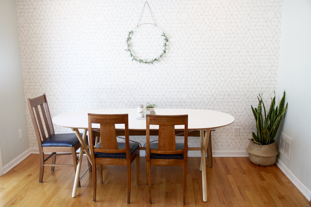 Mid century dining area with IKEA SLAHULT and graphic wallpaper