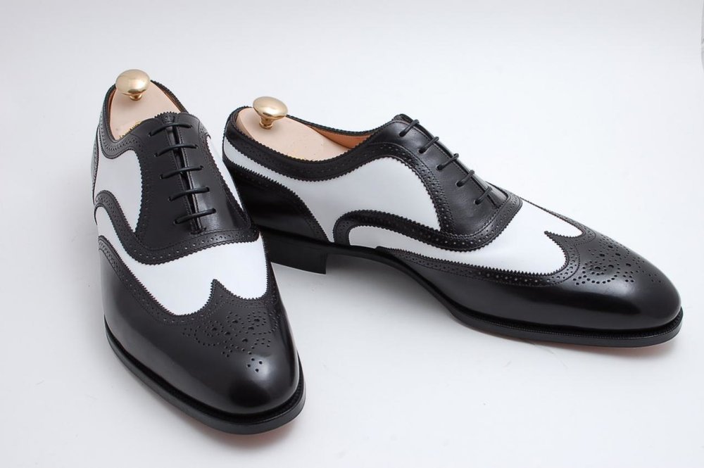 black and white wingtip shoes