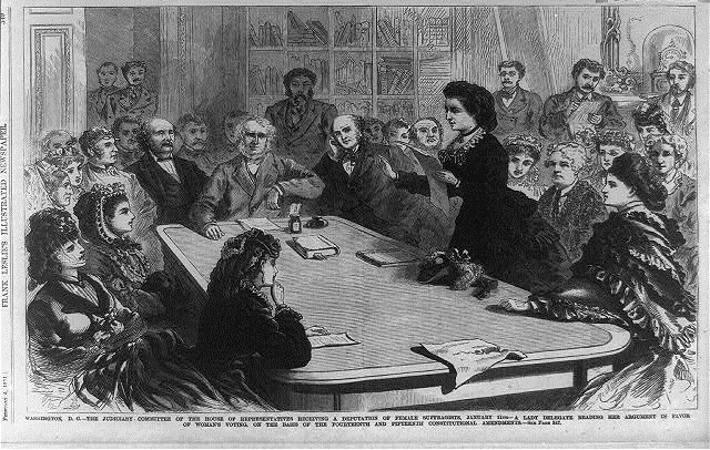 House of Representatives committee receiving a delegate reading her argument in favor of woman's voting, on the basis of the 14th and 15th Amendments, Library of Congress. 