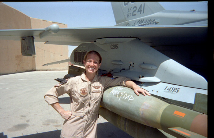  Now-Major Heather Penney poses with an F-16 Viper during one of her two tours in Iraq. (Photo: Heather Penney) 