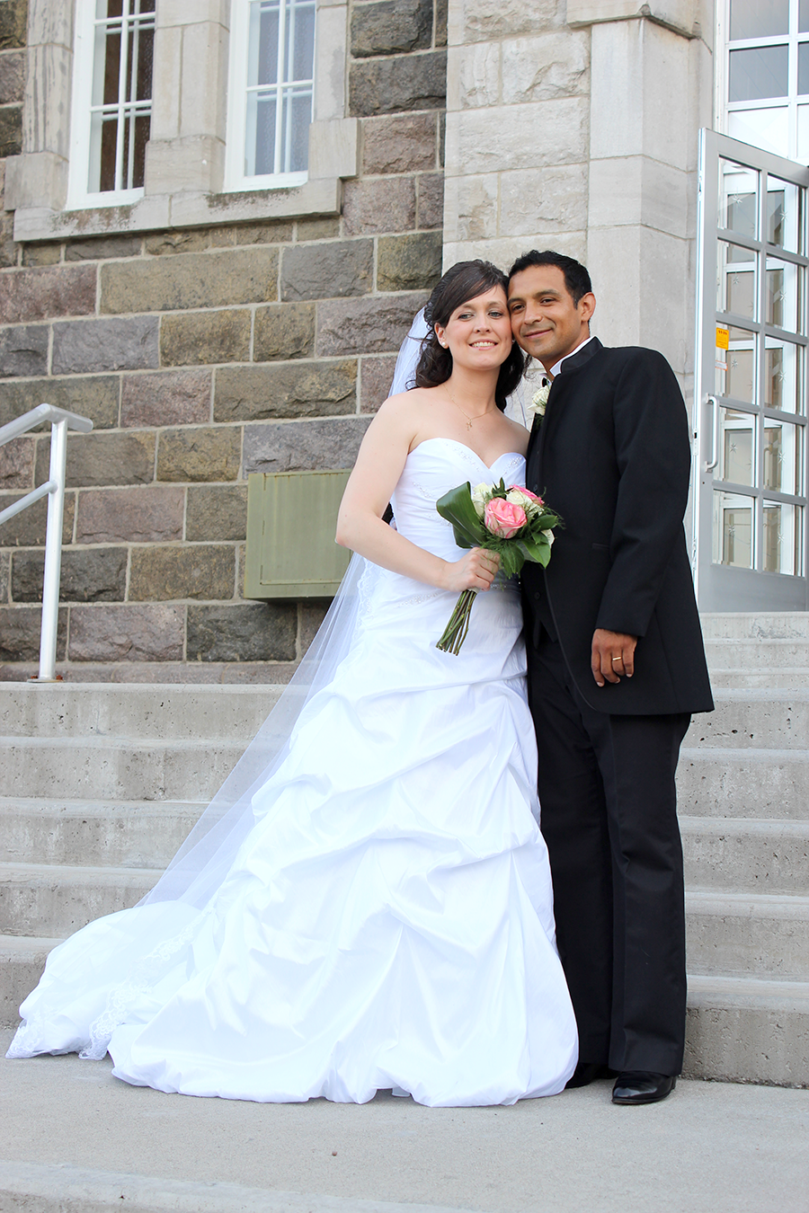 married couple in front of church