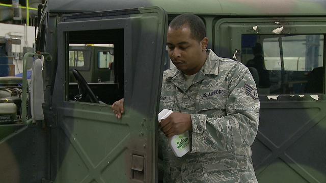 SSgt Daniel F. Moore, 628th Logistics Readiness Squadron (LRS), Joint Base Charleston (JBC), applying BioBlast penetration lubricant to High Mobility Multipurpose Wheeled Vehicle (HMMWV) door latch. (Source: www.soybased.org)