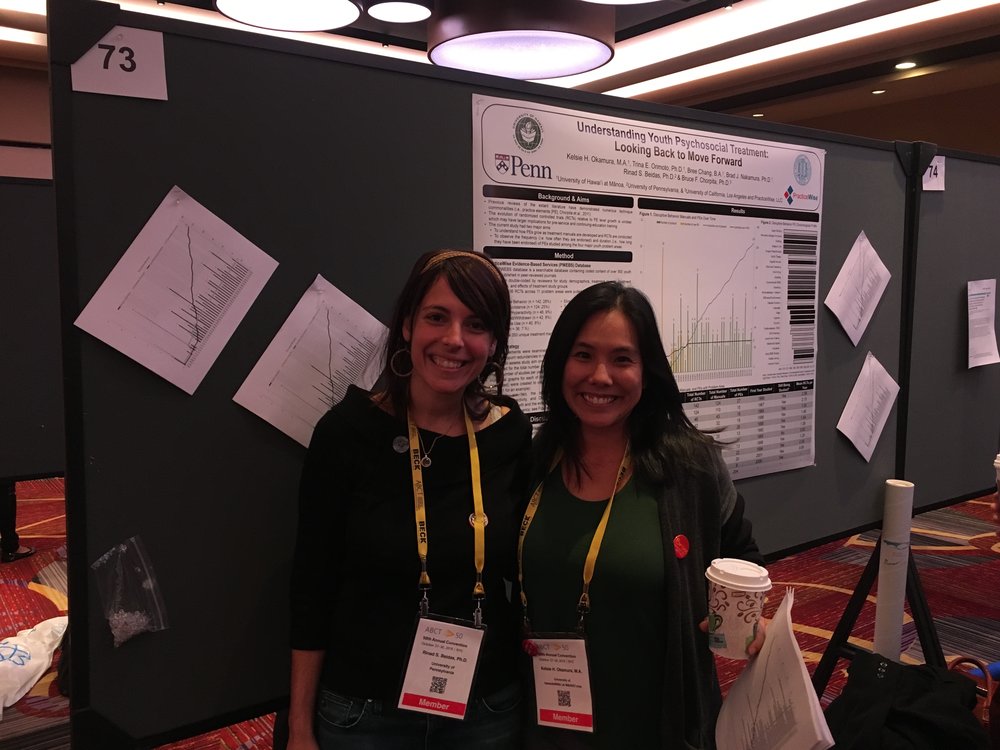 Kelsie Okamura, with Rinad Beidas, presenting a poster at ABCT on understanding youth psychosocial treatment