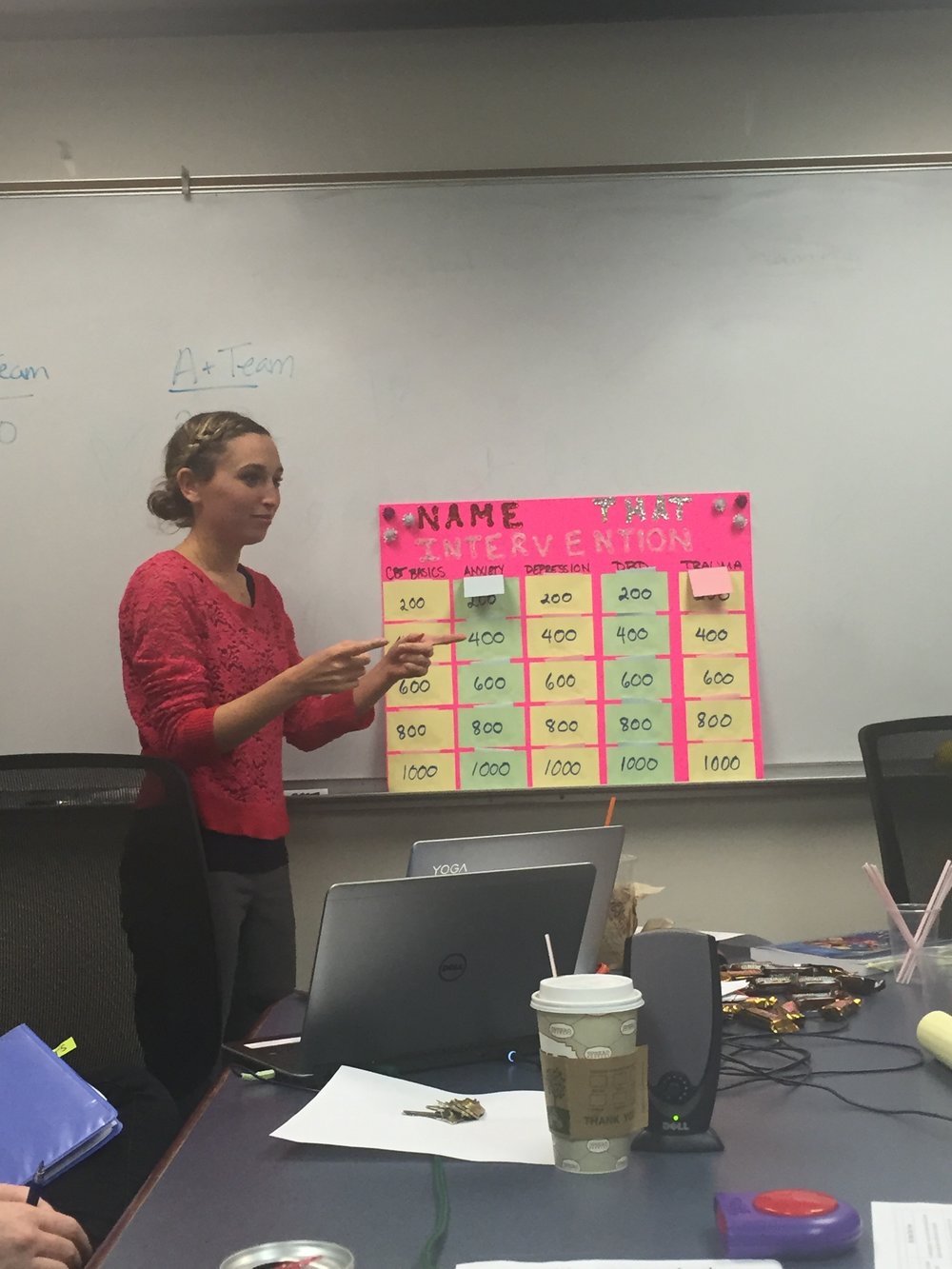 Emily Haimes hosting Jeopardy during a staff CBT training