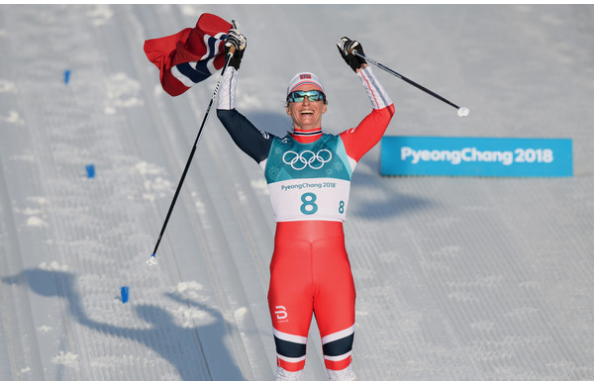 Marit BjÃ¸rgen of Norway celebrates her record-tying eighth Winter Olympic gold medal. (Getty Images.)