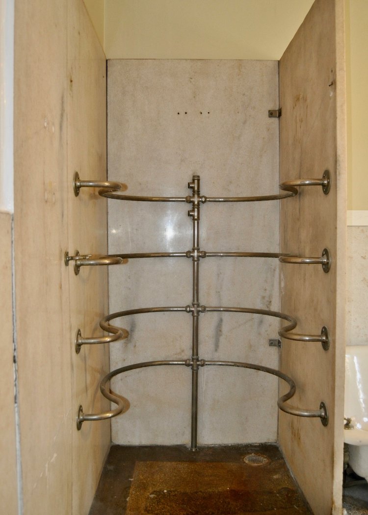 Original needle shower in historic Old West End home