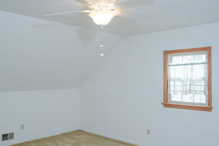 Before shot of the second upstairs bedroom