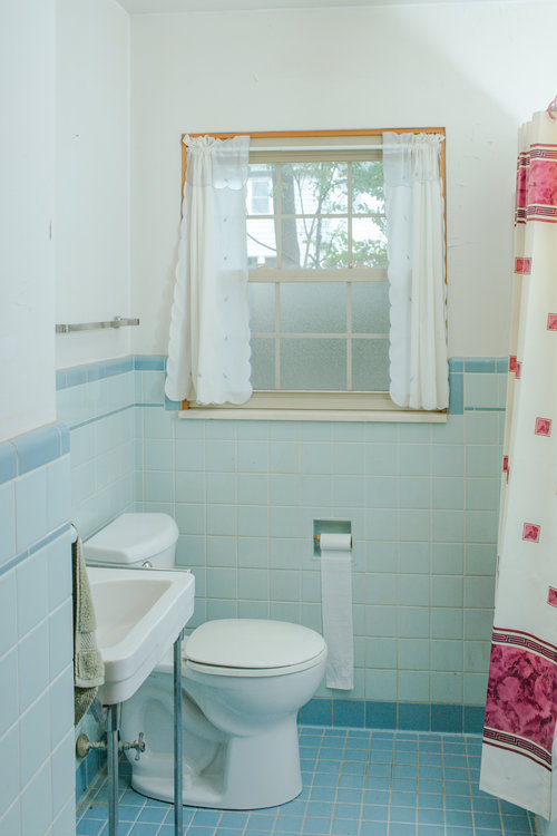 Before, the vintage blue bathroom had lots of charm but needed to be cleaned and painted