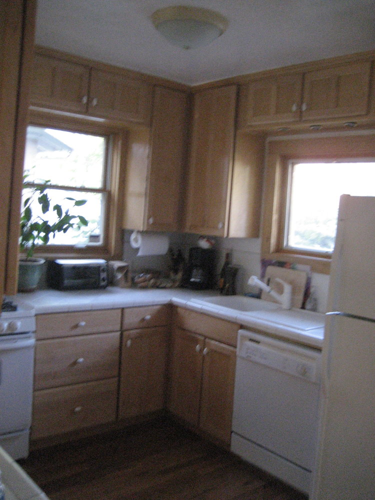 Kitchen before updates at our first flip house.