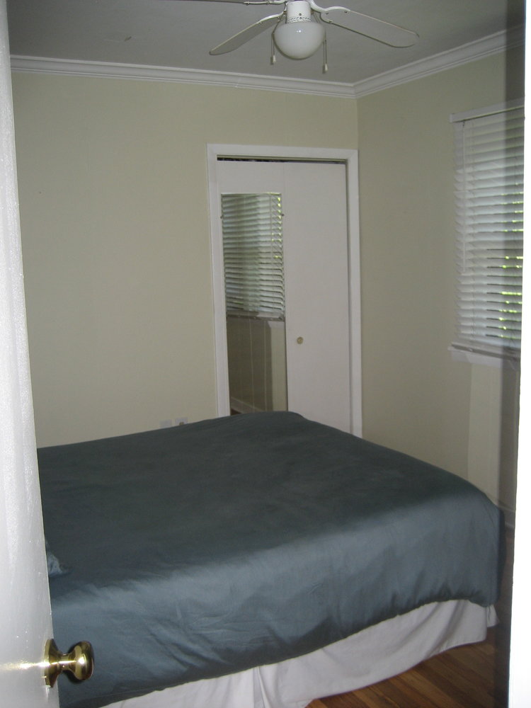 Master bedroom before it was renovated at our first flip house