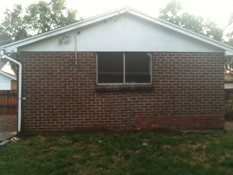 We removed the ivy from the garage wall to prevent further deterioration of the brick structure.