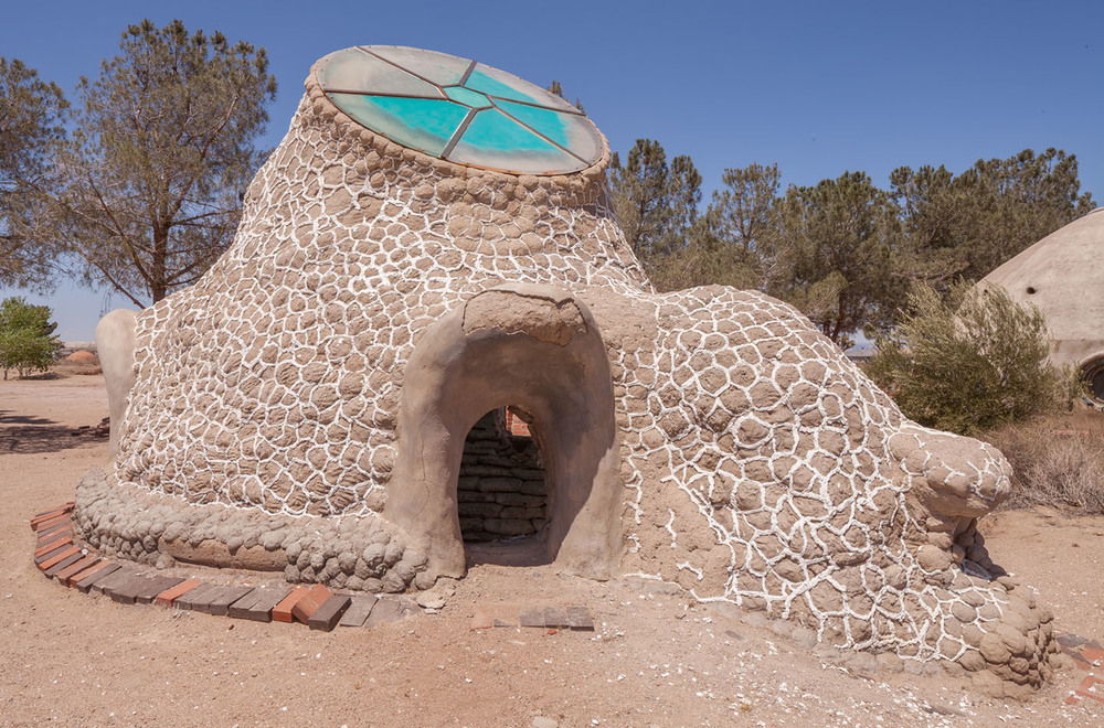 california institute of earth art and architecture. experimental earth-bag dwelling. hesperia, ca. 