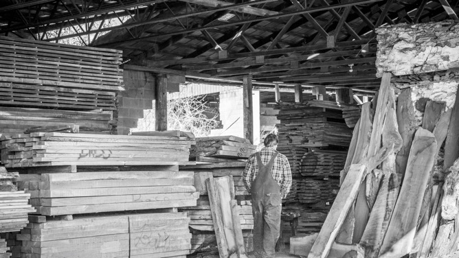  Keith looking for boards in one of his lumber sheds 