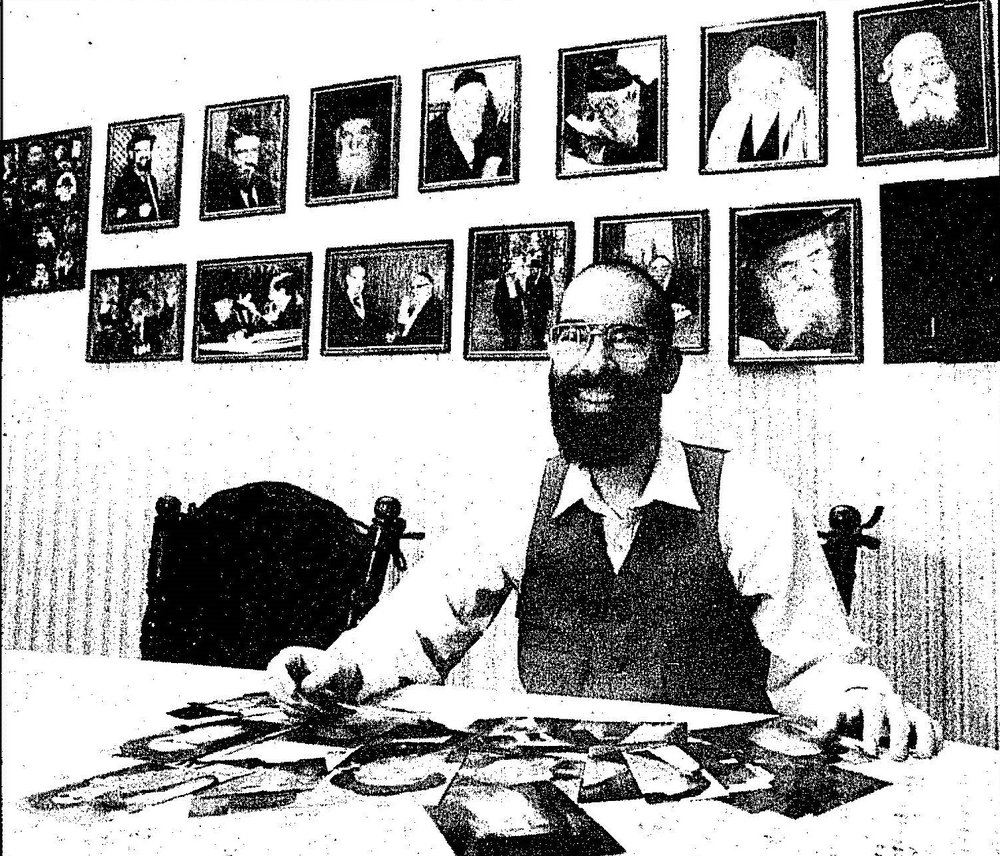 Arthur Shugarman, the founder of Torah Personality Cards, displaying some of his collection. Before launching his 