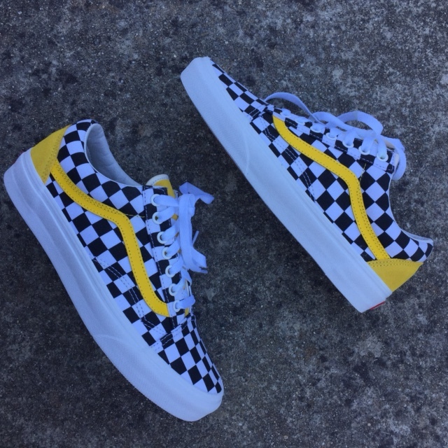 black and white checkerboard vans with yellow stripe